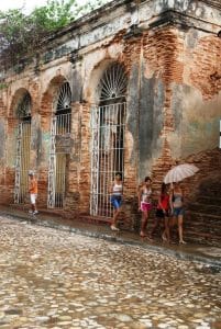 Young people walking down a street in the city of Trinidad